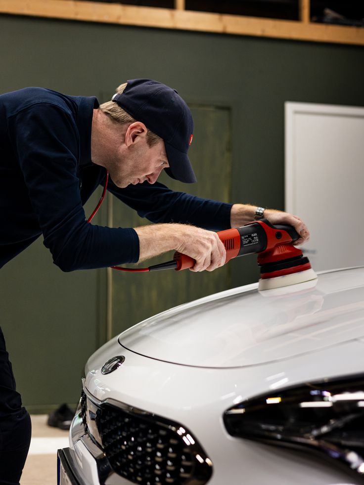 Owner polishing a customer vehicle